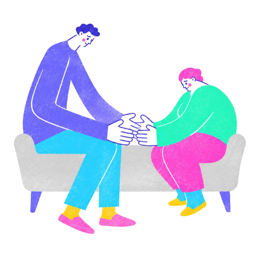 Fenweh — two partners on a sofa holding hands after a difficult conversation, illustrating couples therapy and repair